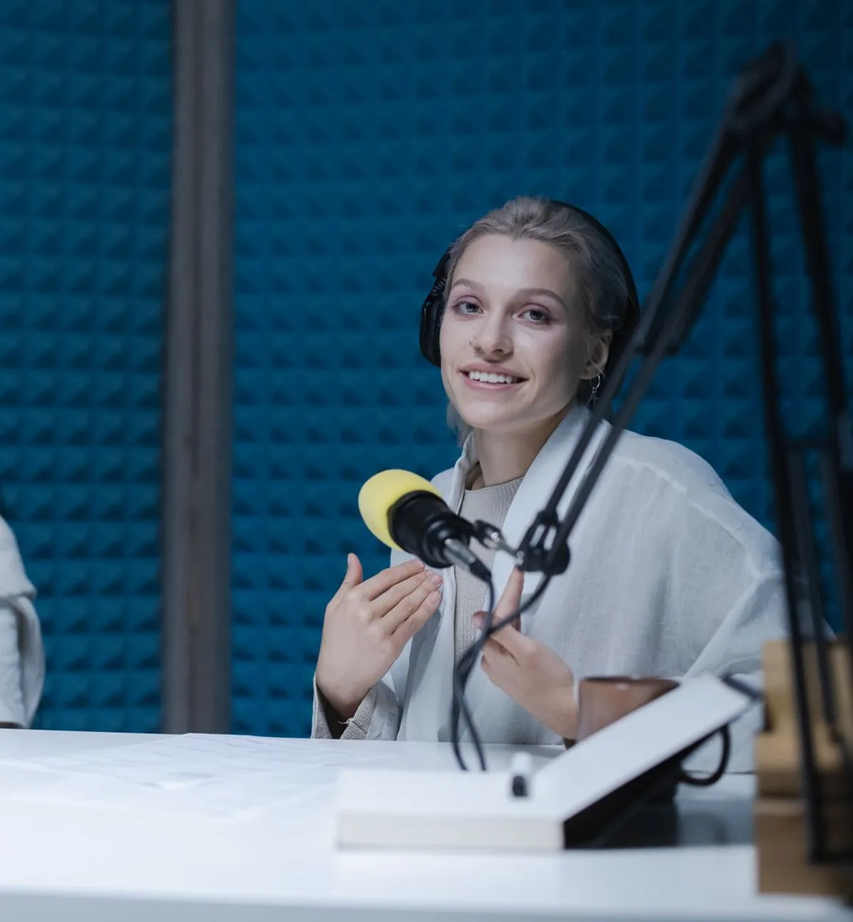 Two hosts recording a podcast
